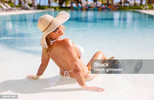 Woman Relaxing In Pool Stock Photo - Download Image Now - Mature Women, Beach, Women