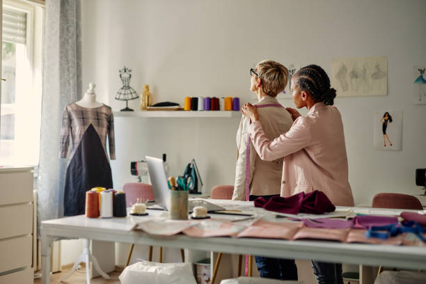 istock African american tailor taking measurements of her customer 1384872255