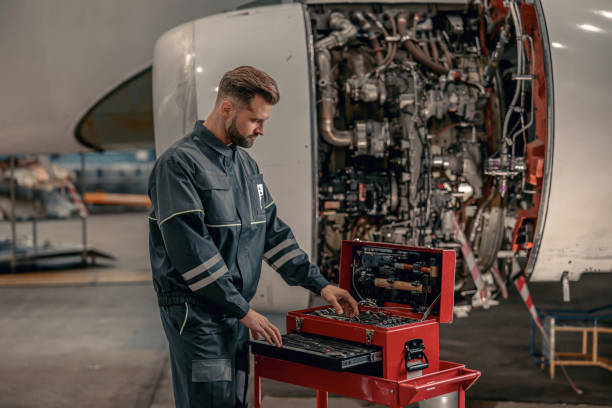 istock Male airline mechanic using tool box in hangar 1384875992