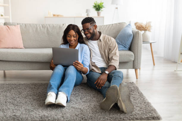 istock Portrait of African American couple using personal computer 1384876165
