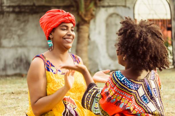 young black woman playing with her daughter.
