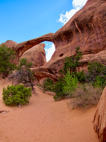 These two arches in Devil's Garden, Arches National Park, are part of the same sandstone fin. The large arch spans 71 feet and is stacked atop a much smaller arch with a 21 foot span. May 2011.