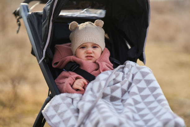 istock Baby girl in a buggy 1384887773