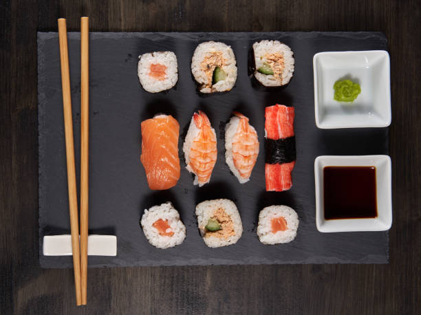 istock Sushi variety on a black stone 1384888085