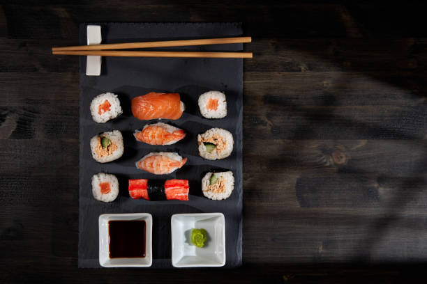 istock Sushi variety on a black stone 1384888088