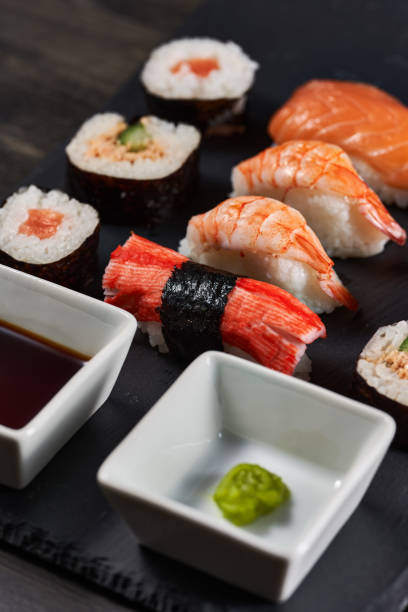 istock Sushi variety on a black stone 1384888114
