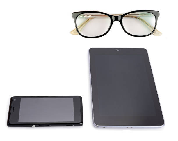 Mobile phone, tablet and glasses isolated on white . Free space for text.