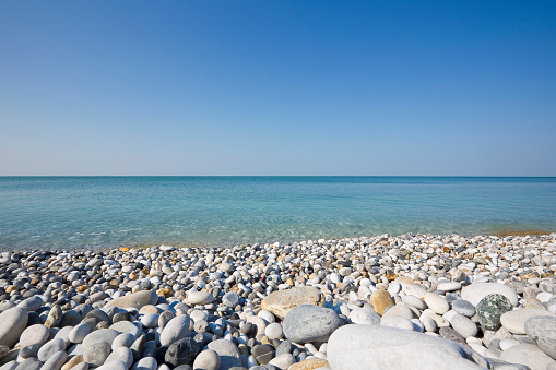 Clean flat sand beach of Mediterranean sea in Israel. 16x9 format.