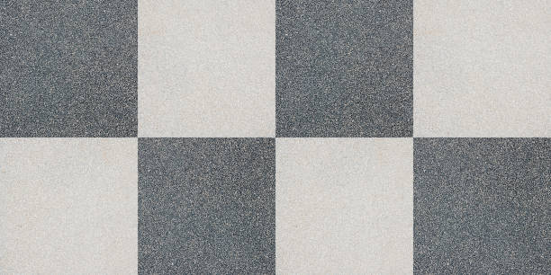 istock Perfect concrete and grit floor pavement seamless pattern in the shape of a chessboard - high resolution texture useful for renderings applications 1384889433
