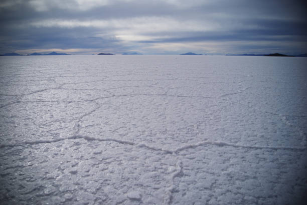 Uyuni Salt Flats. Altiplano, Bolivia. Rainy Season. Tunupa Volcano. Clouds Reflection on Water in Lake Surface