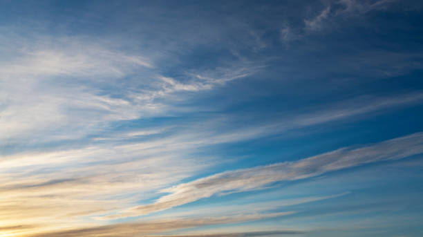 istock Beautiful bright sunset sky with clouds. Sky background. 1384891702
