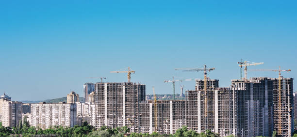 istock construction cranes in the  Kyiv city, Ukraine 1384892836