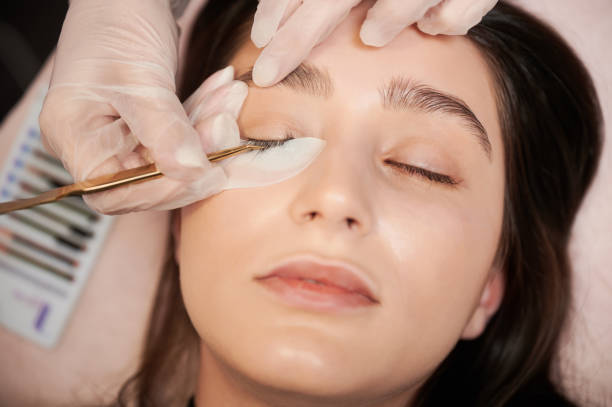 istock Beauty specialist applying eyelash extensions in beauty salon. 1384893156