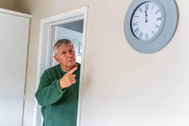 istock Senior Caucasian man peering around doorway 1384893616
