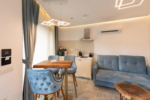 istock Interior of a modern new kitchen with dining table and chairs 1384894312