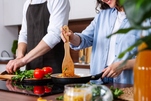 istock Couple cooking together. 1384895715