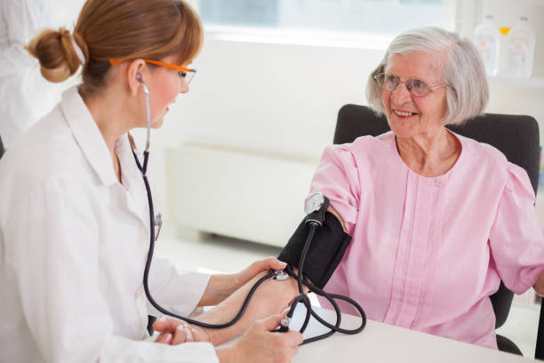 istock Senior woman visiting doctor. 1384896196