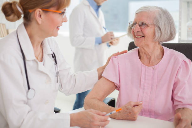 istock Senior woman visiting doctor. 1384896318