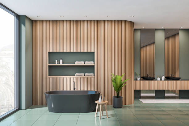 istock Dark bathroom interior with bathtub, two mirrors, sinks, panoramic window 1384898483