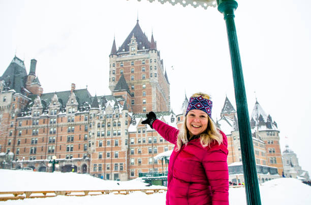 istock Woman pointing at Chateau Frontenac 1384898503