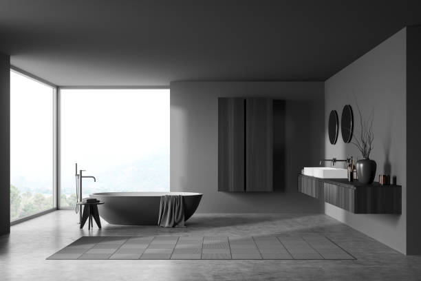 istock Modern bathroom interior with bathtub, sink and mirror near window 1384898666
