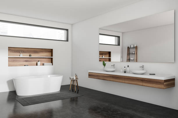 istock Light bathroom interior with sink and mirror, bathtub and decoration 1384898725