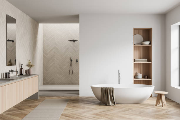 istock Light bathroom interior with shower and bathtub, rack with decoration 1384899436