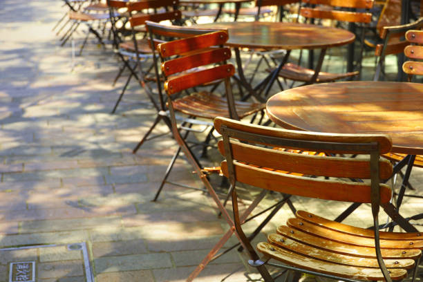 istock Cafe terrace on an empty street corner on a spring morning 1384899965