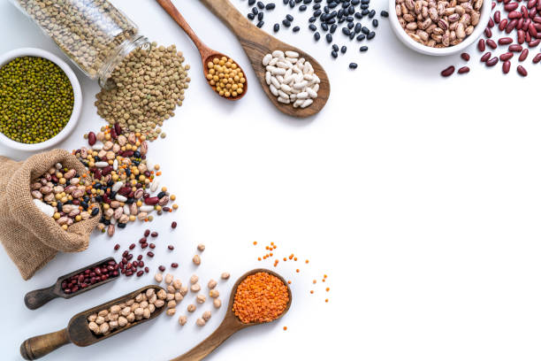istock Assorted dried legumes isolated on white background copy space 1384901145