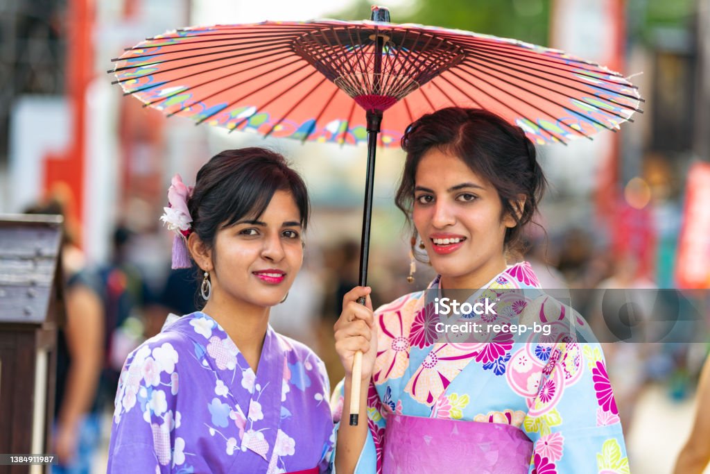 Portrait of two female tourists experiencing wearing kimono in Japan A portrait of two female tourists experiencing wearing kimono in Japan. Asakusa Stock Photo