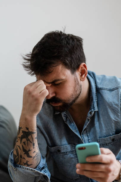 istock Handsome man stressed about bad news he just read 1384930633