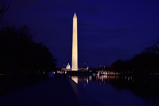 Moon Rising Behind the Washington Monument With the World War II Memorial in the Foreground