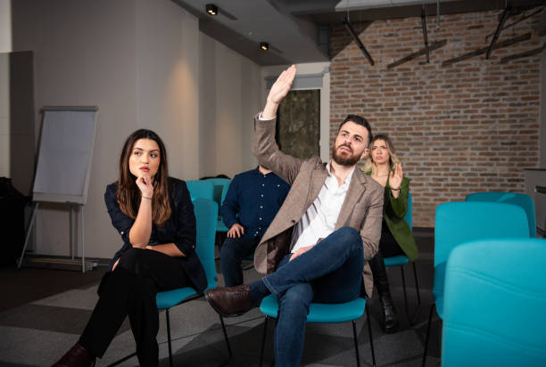 istock Small group of people at a business seminar 1384936706