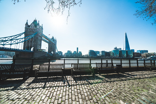 Park bench with view to River Thames and Tower Bridge in London