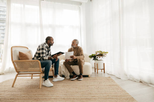 istock Broker on  the meeting with senior men 1384946615