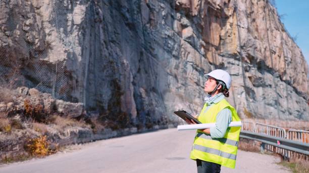 istock Female road construction engineer working. Building new highways. 1384946751