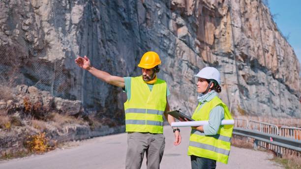 istock Road construction engineers working. Building new highways. 1384946761
