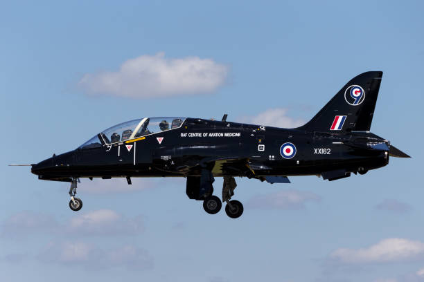 Royal Air Force (RAF) Hawker Siddeley Hawk aircraft on approach to land at Fairford. Gloucestershire, UK - July 10, 2014: Royal Air Force (RAF) Hawker Siddeley Hawk T.1 aircraft XX162 on approach to land at Fairford. british aerospace stock pictures, royalty-free photos & images