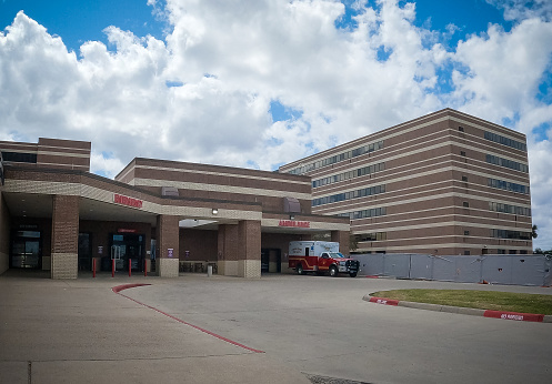 Corpus Christi, Texas, USA--Sunday, March 13, 2022: A file photo with exterior view of Christus Spohn Hospital-South Emergency Room with an ambulance parked outside on Sunday, March 13, 2022.