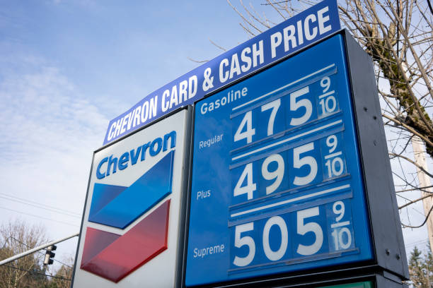 Soaring Prices of Oil and Gas West Linn, OR, USA - Mar 11, 2022: The gas price sign at a Chevron gas station in West Linn, Oregon. Oil and gas prices are soaring due to Russia's war in Ukraine. fuel prices photos stock pictures, royalty-free photos & images