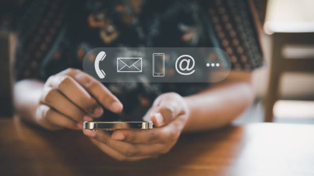 istock Contact Us Support Service and Information Connect Concept, Female's Hands is Using Mobile Phone and Laptop for Corporate Information Contact Via Email Support. Customer Communication Contact Services 1384983570