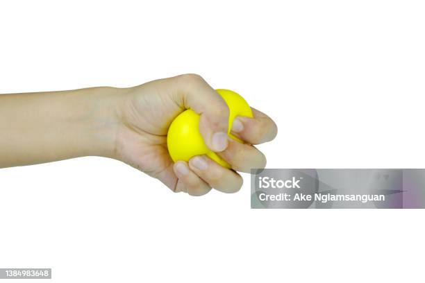 Hands Of Man With A Gentle Personality He Exhibits Stressful Behavior From Work And He Squeezes The Yellow Ball Expressing Emotion Anger Displeasure Medical Concepts And Emotional Regulation Stock Photo - Download Image Now