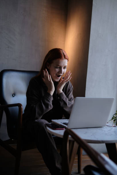 istock red-haired woman freelancer works remotely on 1384989288