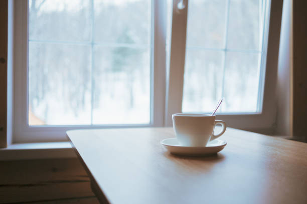 istock A cup on the table in front of the window. 1384989292