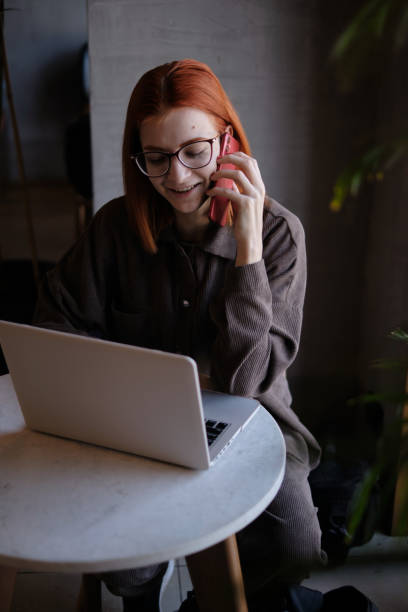 istock red-haired woman freelancer works remotely on 1384989453