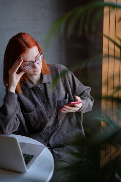 istock red-haired woman freelancer works remotely on 1384989604