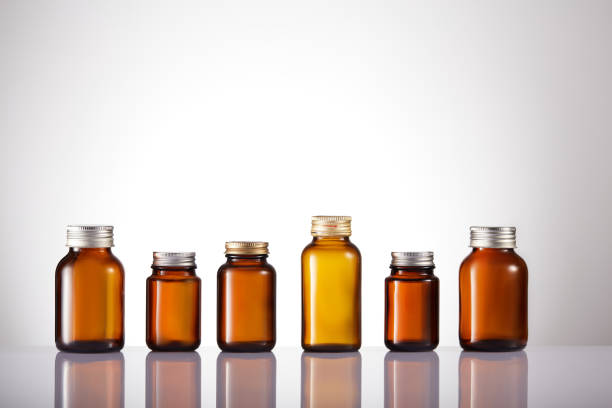 istock Set of empty brown glass medicine bottles. Amber bottle samples. 1384997953