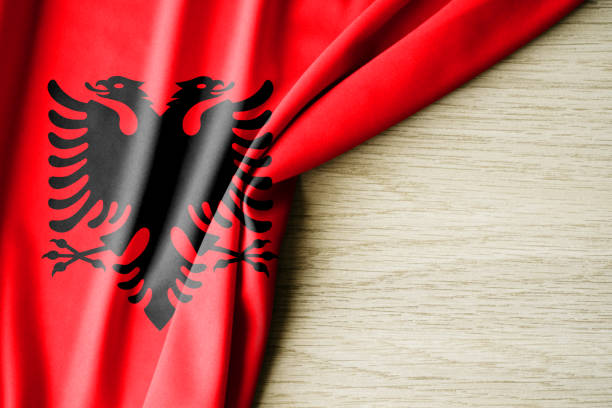 Albania flag. Fabric pattern flag of Albania. 3d illustration. with back space for text. Close-up view.