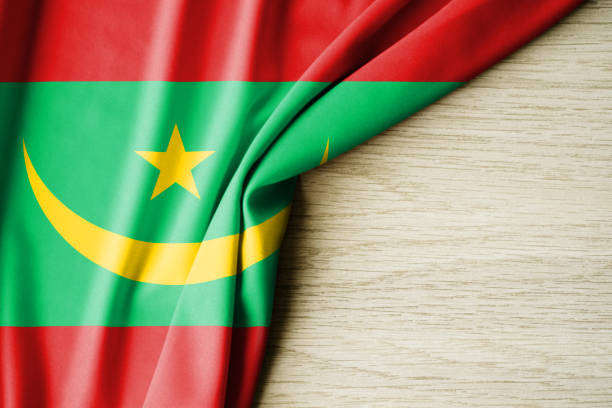 istock Mauritania flag. Fabric pattern flag of Mauritania. 3d illustration. with back space for text. 1385019133