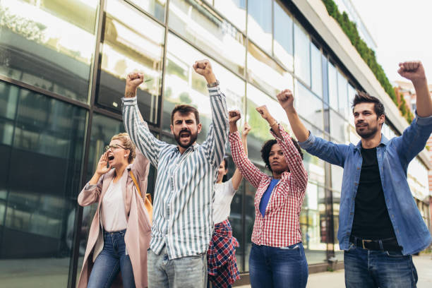istock Group of people activists protesting on streets 1385049602